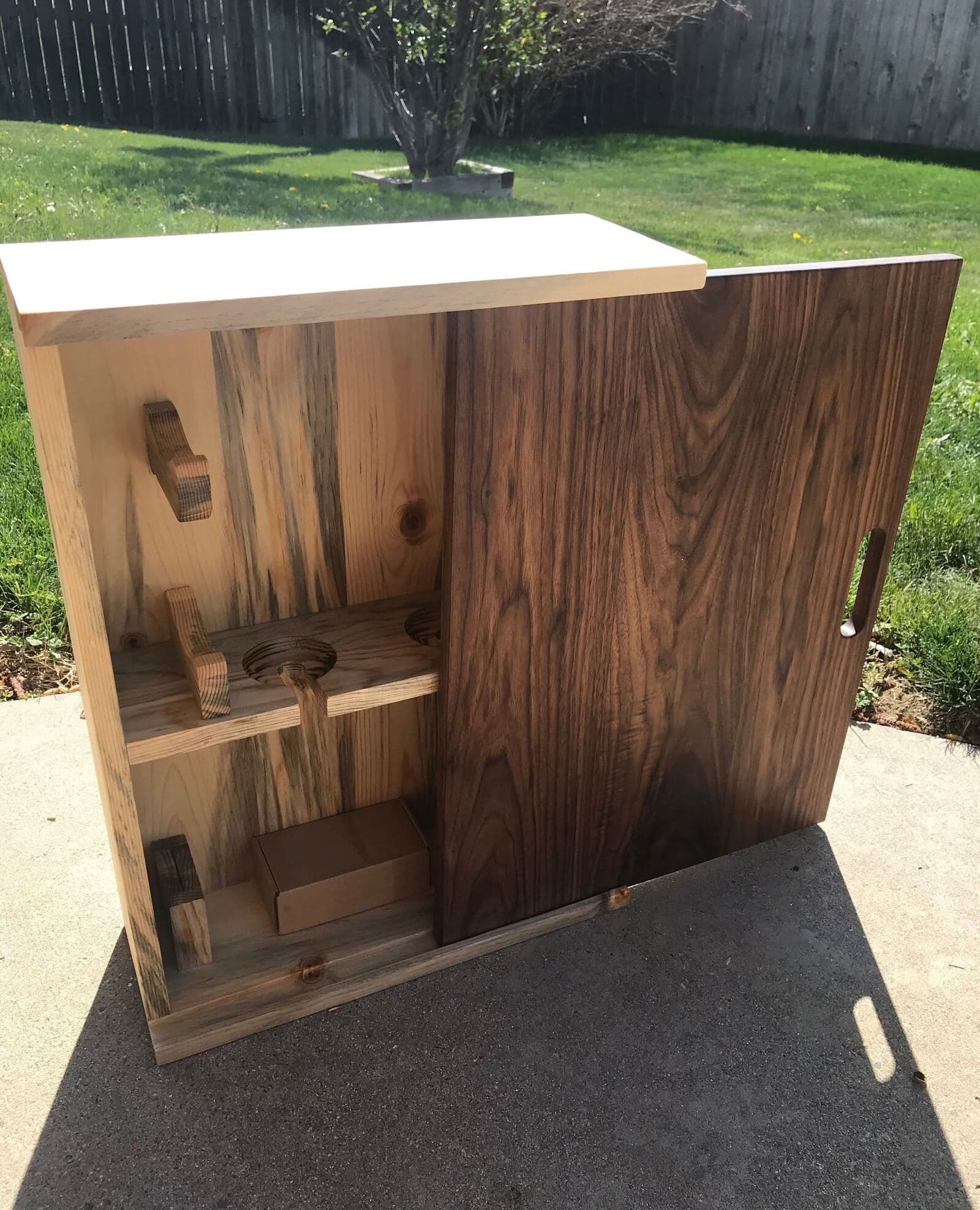 Beetle-kill pine wine cabinet with walnut sliding door